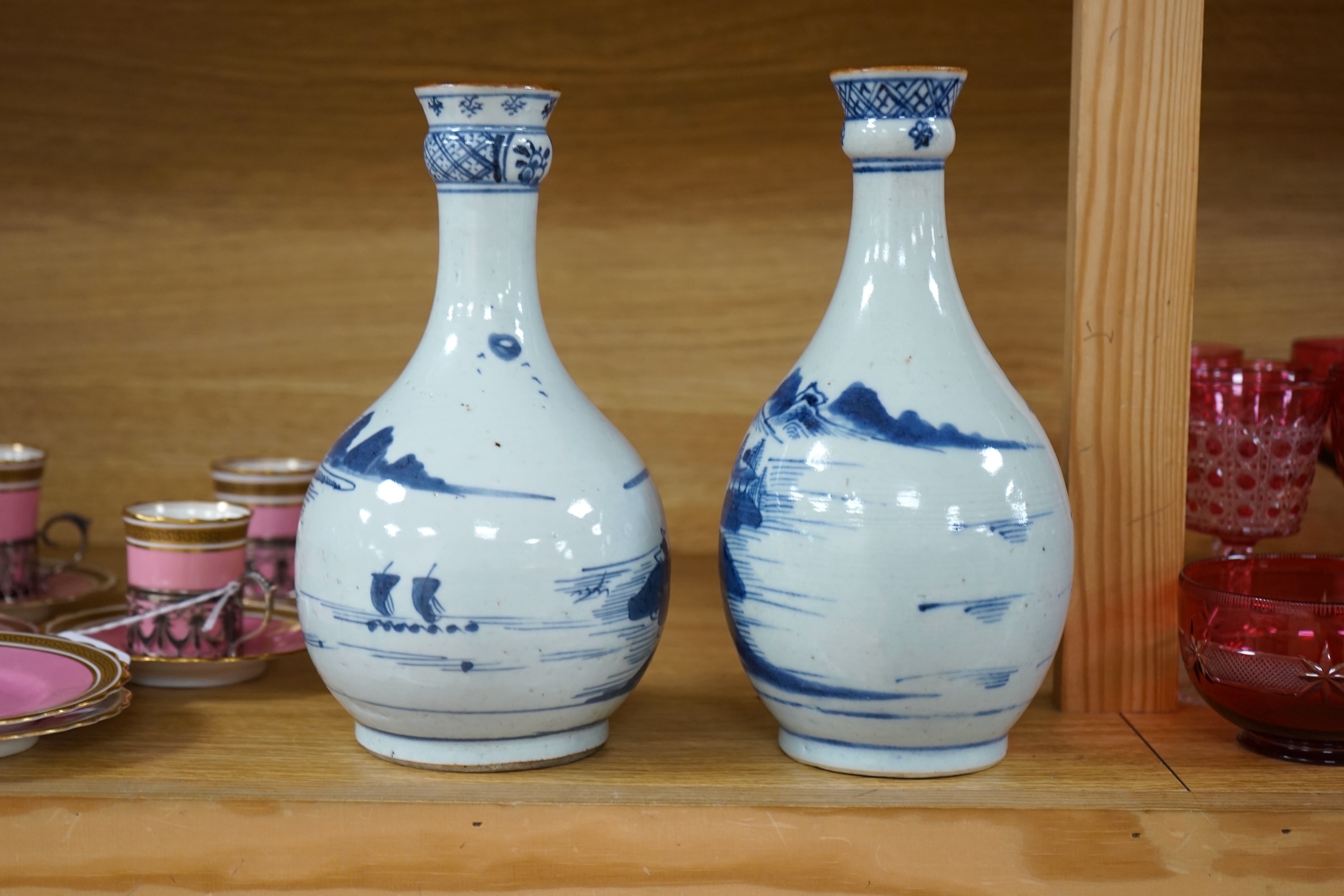 Two Chinese blue and white guglet bottles, 18th century, tallest 24cm high. Condition - good